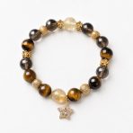 Golden Ascent natural crystal bracelet with Tiger’s Eye, Citrine, and Smoky Quartz on a white background.