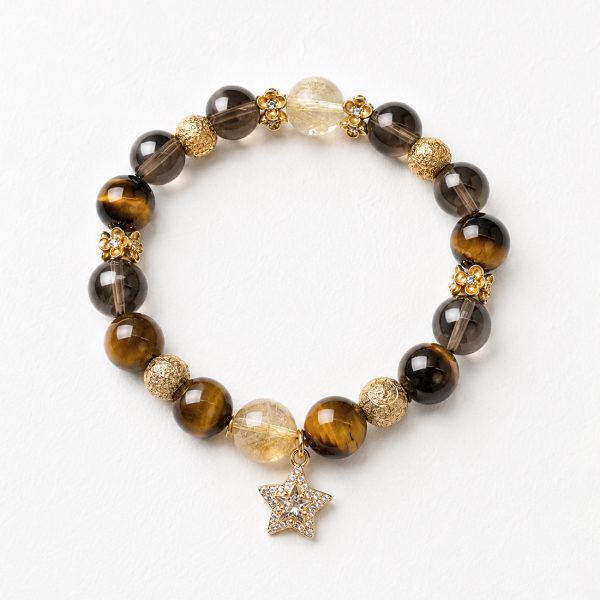 Golden Ascent natural crystal bracelet with Tiger’s Eye, Citrine, and Smoky Quartz on a white background.