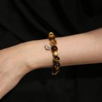 Golden Ascent natural crystal bracelet worn on wrist.