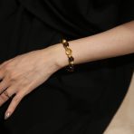 Golden Ascent natural crystal bracelet worn on wrist.