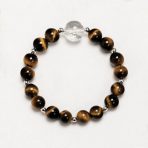 Sunlit Resolve natural crystal bracelet with Golden Tiger’s Eye and Clear Quartz on a white background.