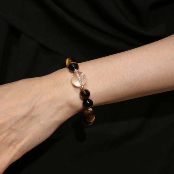 Sunlit Resolve natural crystal bracelet worn on wrist.